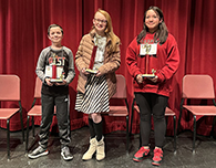  Cooper Tobler, 3rd place; Luci Samaco, 1st place; and Khiya Phillips, 2nd place.
